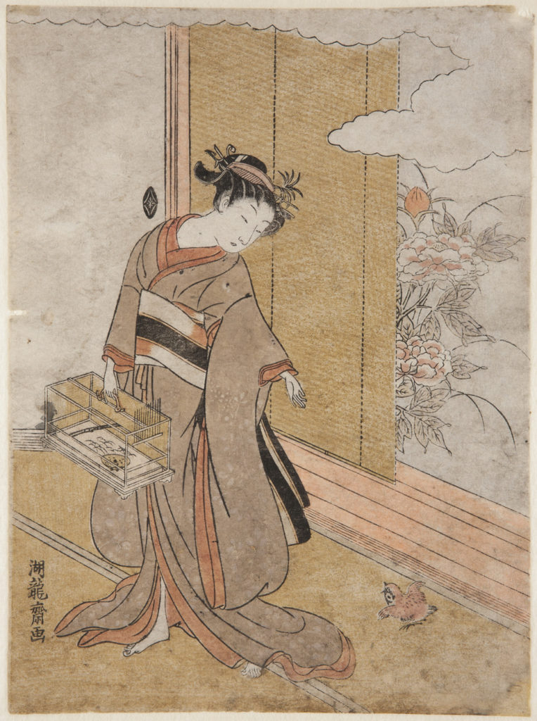 Japanese print of a woman dressed in traditional clothes holding a cage, she looks down at a small bird sitting on the floor next to an open door with a garden outside.