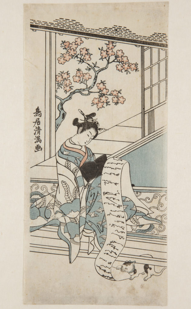 Japanese print of a woman dressed in traditional clothes, she sits by a window with blossom outside, and reads a long scroll of paper, a cat playfully grabs the paper from under the bench.
