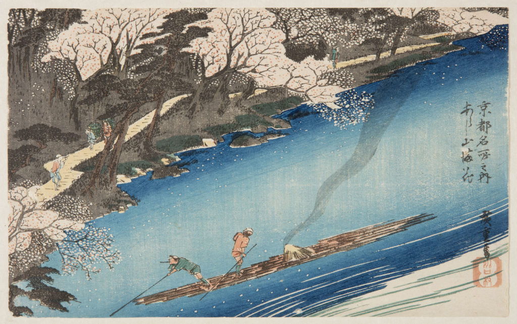 Japanese print of a river scene, two men punt their barge down the river, people walk along the banks through the cherry trees.