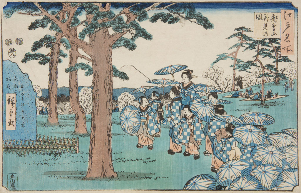 Japanese print of a large group of children and adult, all dressed in the same traditional clothes and holding umbrellas, they walk amongst the trees, picnickers sit under the trees in the background.