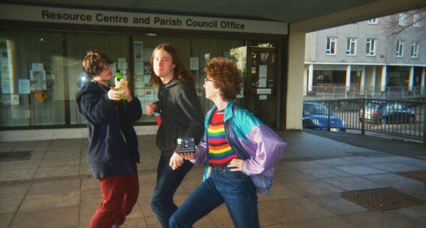 Elio's photograph (for the 21st Century Kids) of his friends posing for the camera outside the council office building