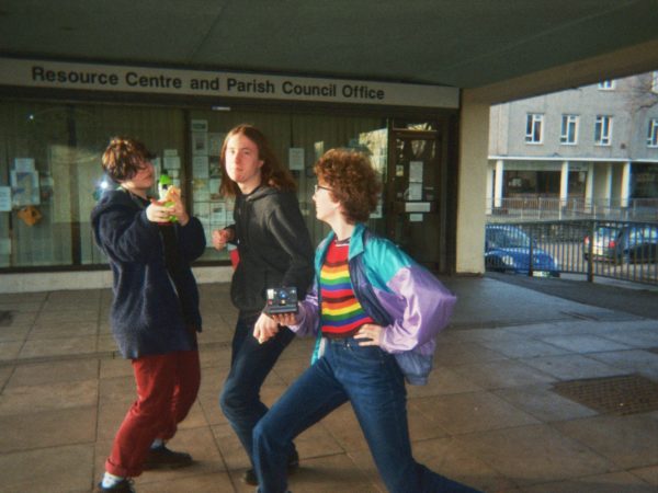 Elio's photograph (for the 21st Century Kids) of his friends posing for the camera outside the council office building