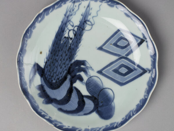Dish with design of lobster and rice measure crests in blue on white