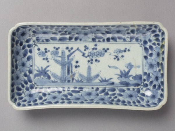 Rectangular dish with young pine and plum blossom design in blue on white