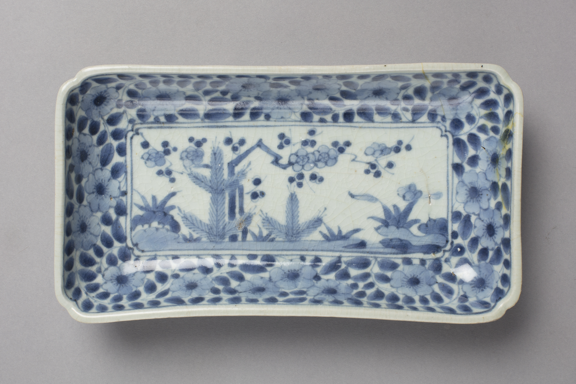 Rectangular dish with young pine and plum blossom design in blue on white