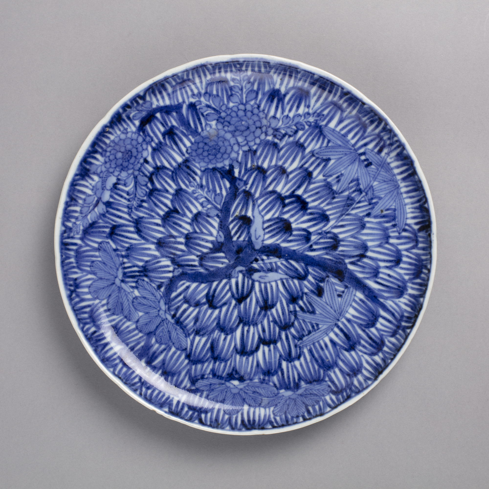 Dish with blue on white design of pine, bamboo, and plum