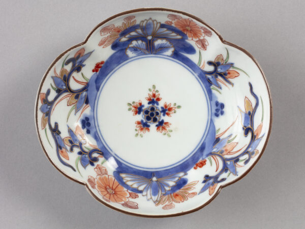 Lobed bowl with floral decorations in blue and orange