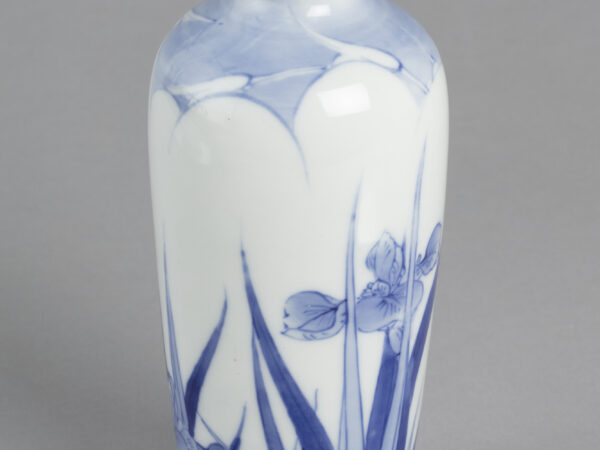 Vase with blue on white design of egrets with irises