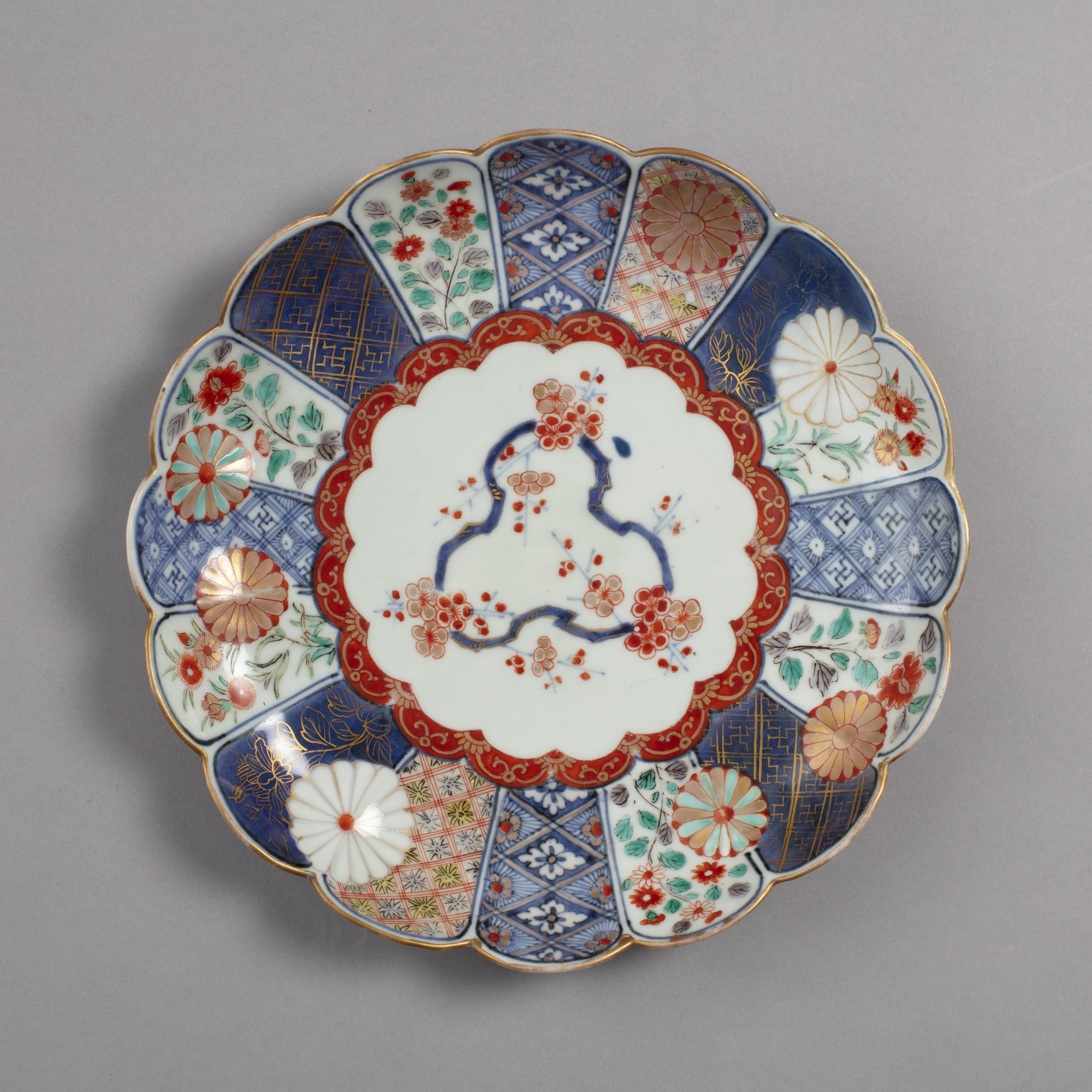 Dish with design of chrysanthemums and plum blossoms in blue, red and green