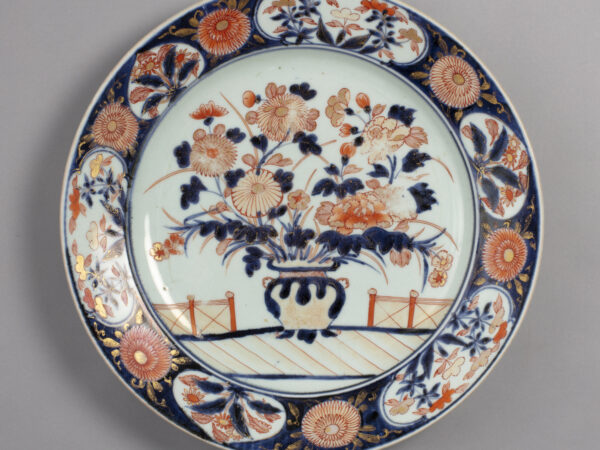 plate with a vase of flowers design in blue, red and gold decoration