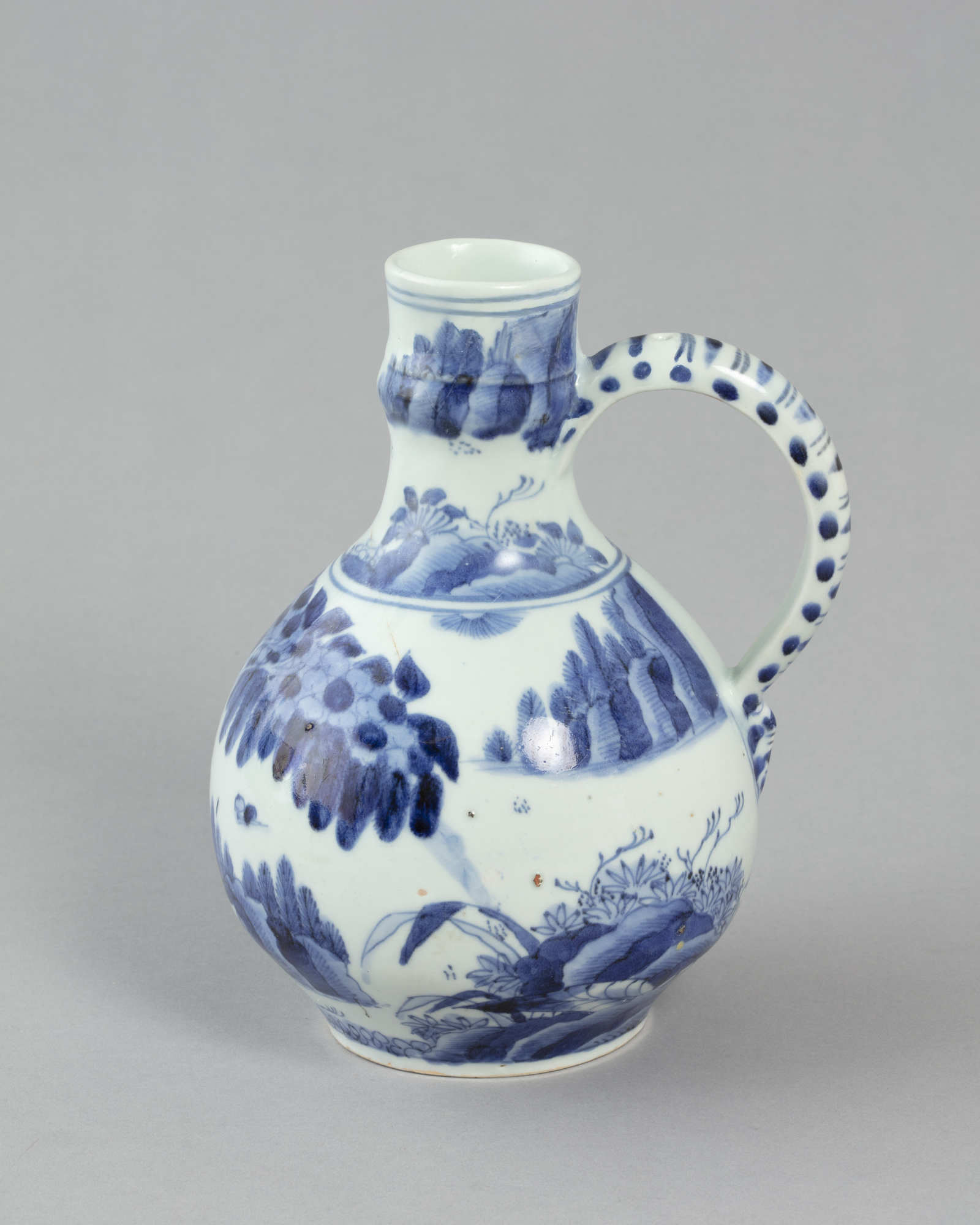 Wine jug with design of figures in landscape in blue decoration