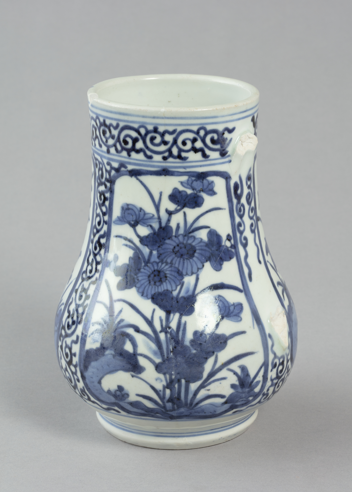 Beer mug with design of flowers and rocks in blue