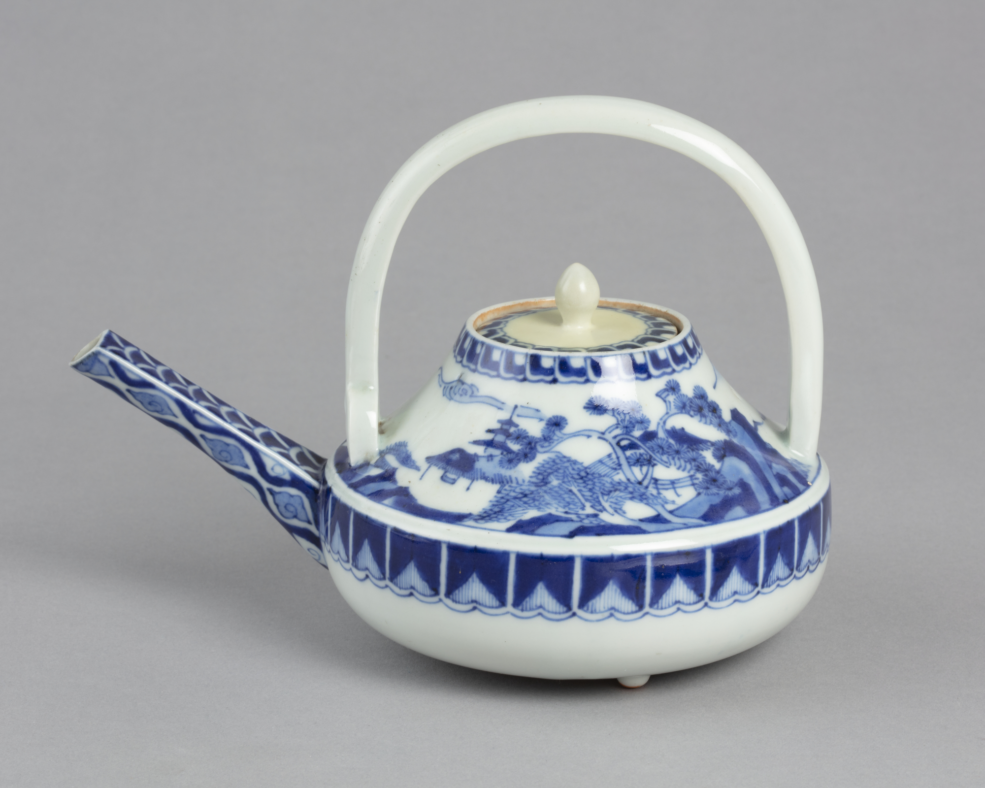 Sake ewer which looks like a teapot with a blue on white design