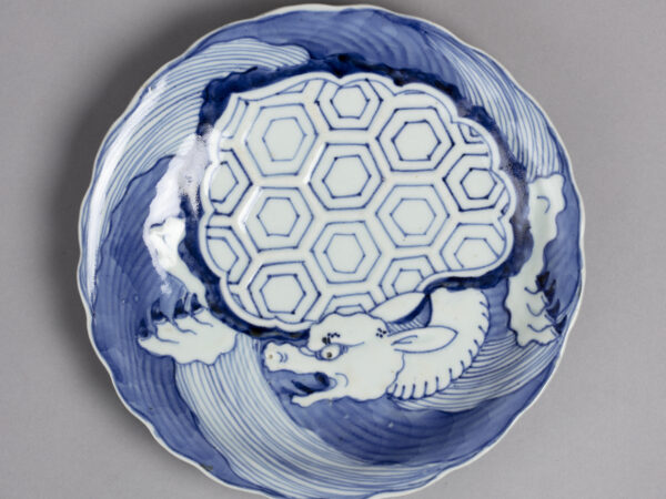 Dish with blue on white design of minogame turtle