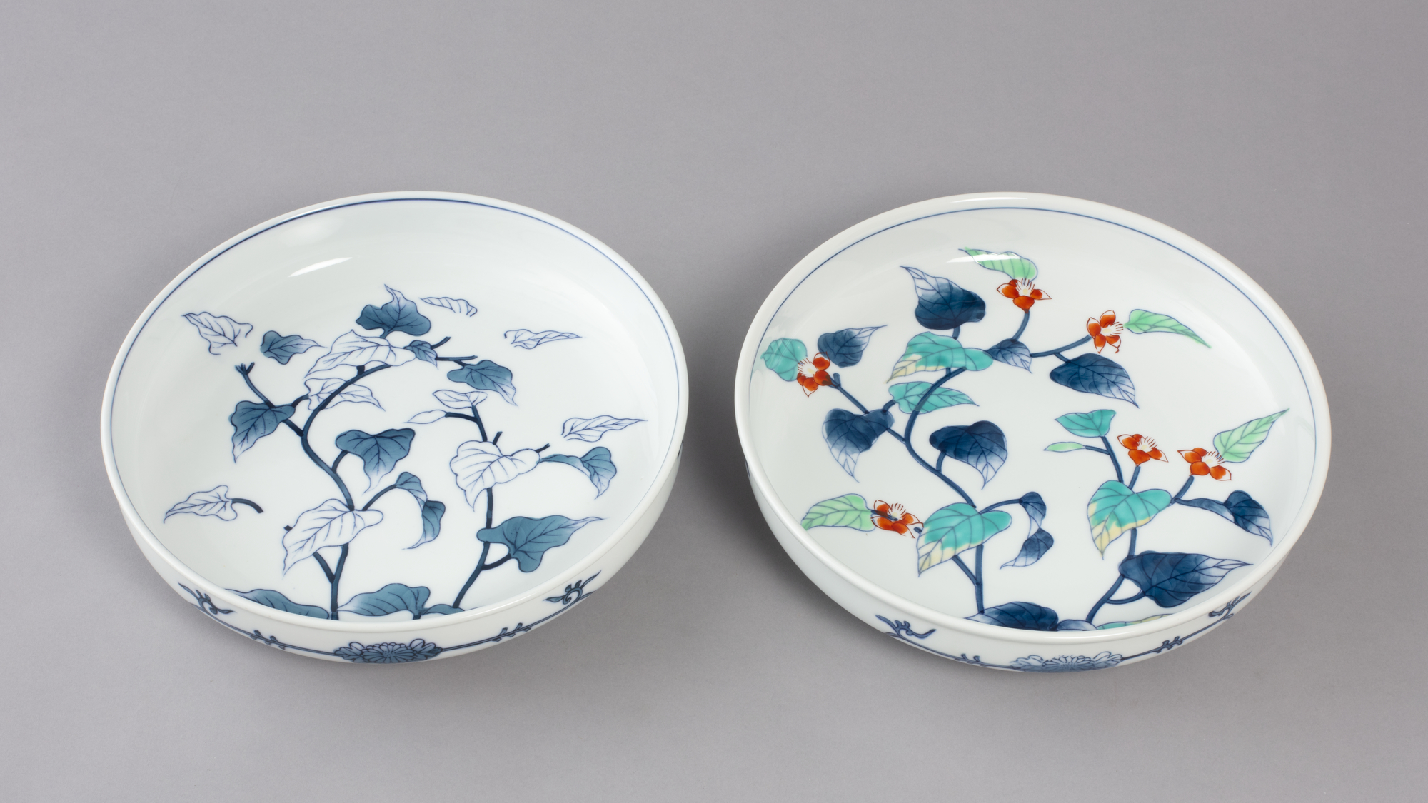 two bowls with leaf and floral pattern paintings