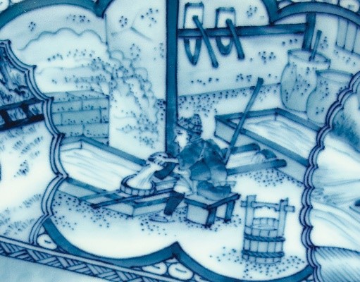 detail of a design on a dish showing cleaning and mixing