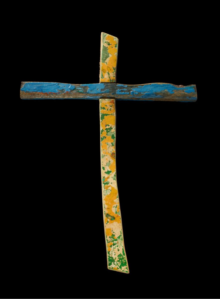 The Lampedusa Cross - a wooden cross covered with flecks of blue, green and yellow paint.