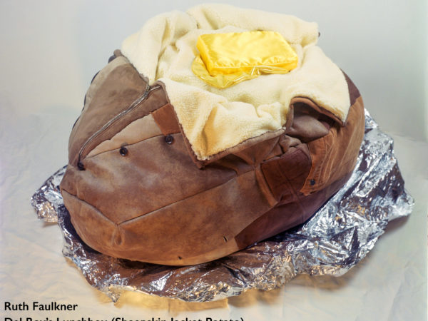 a jacket potato sculpture made out of a leather jacket