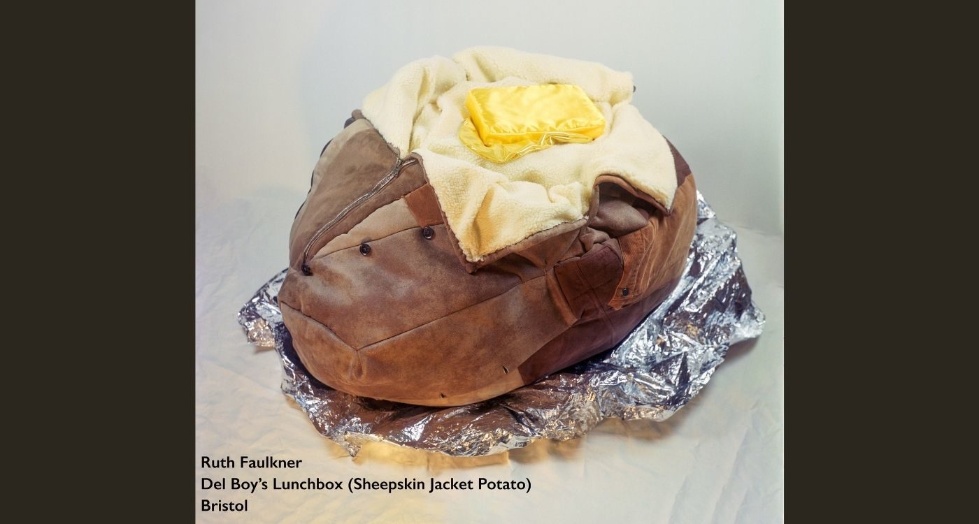 a jacket potato sculpture made out of a leather jacket