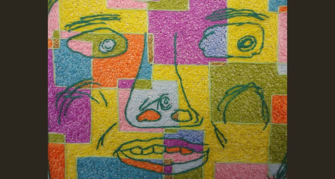 a colourful stitched face