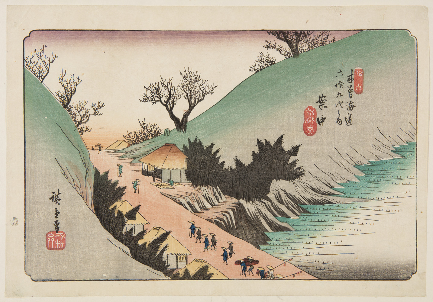 Japanese print of a mountain road. Travelers walk along the road, in traditional clothes. The road has small buildings either side.