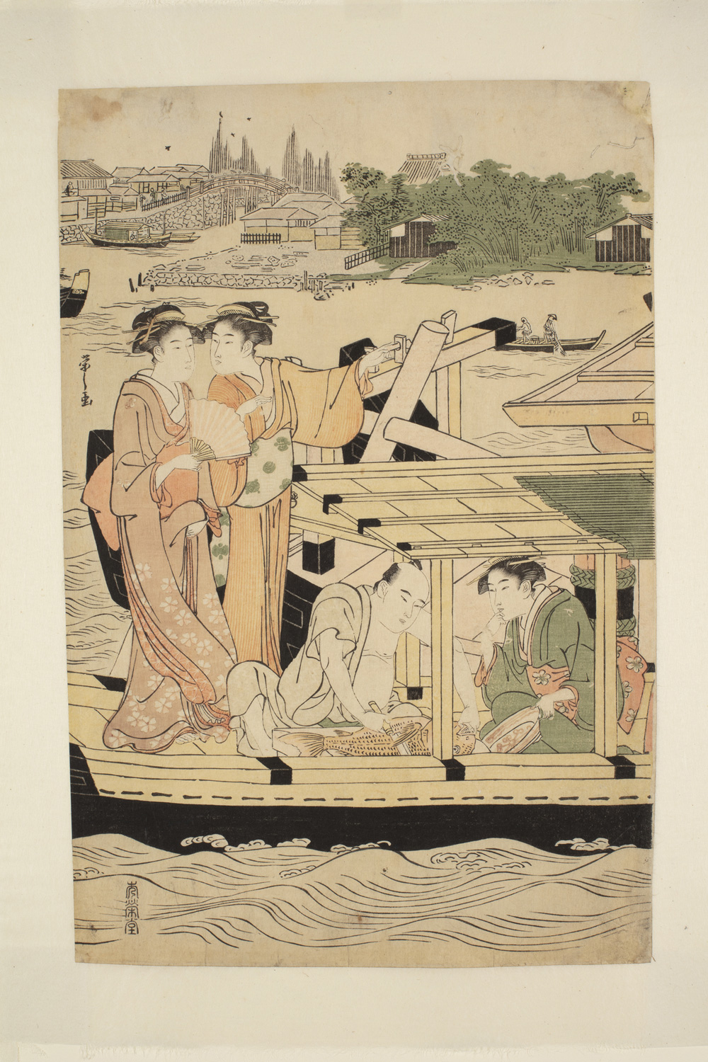 Japanese print of a river scene. Four people are on a boat on the river. Two women, in traditional clothes, are standing and two people are seated under a canopy. In the distance we see small boats and, on the far bank, a town.
