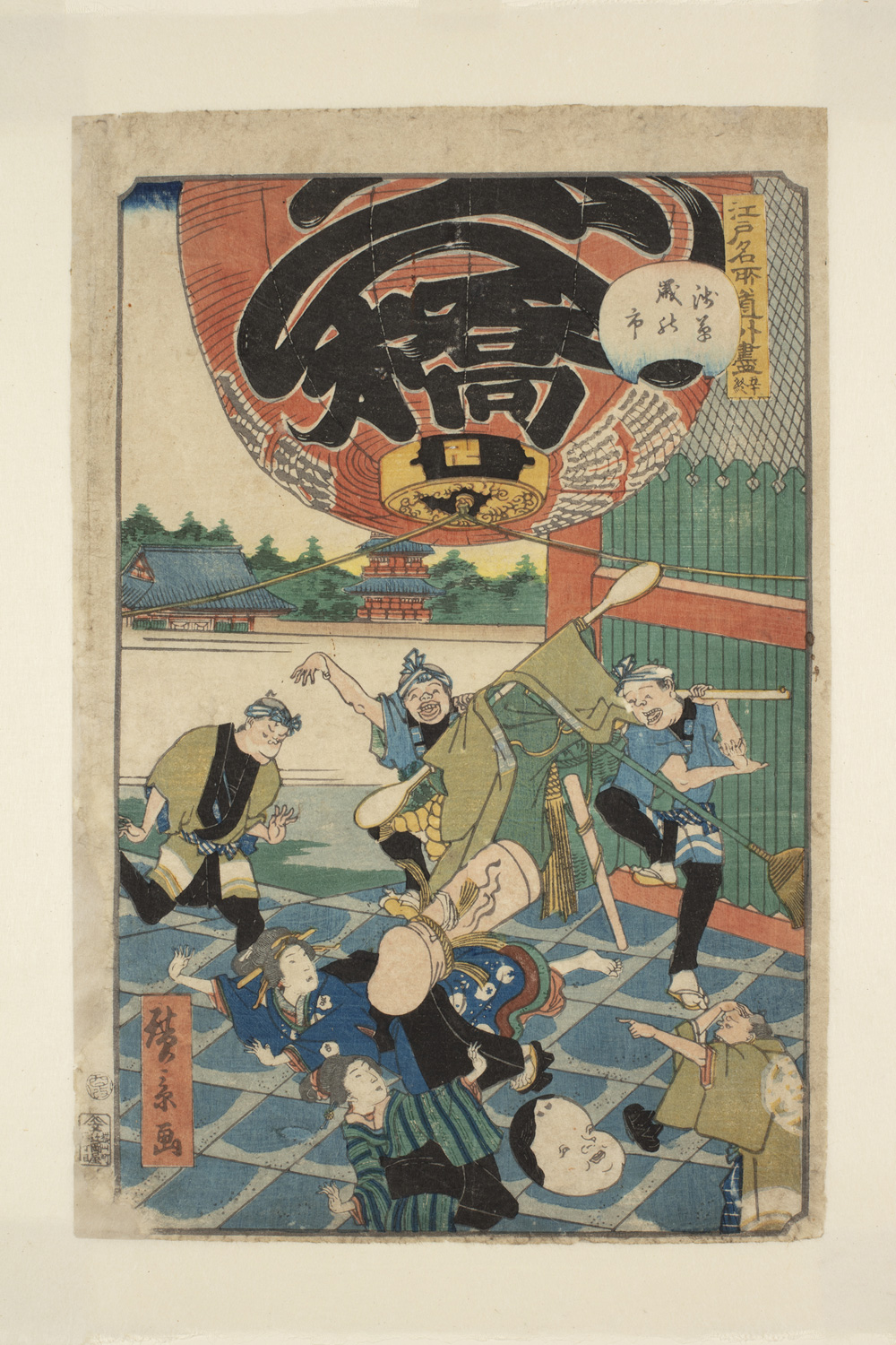 Japanese print of a group of six people dancing on a stage in traditional clothes. Above them is a large lantern and in the background there are buildings and trees.