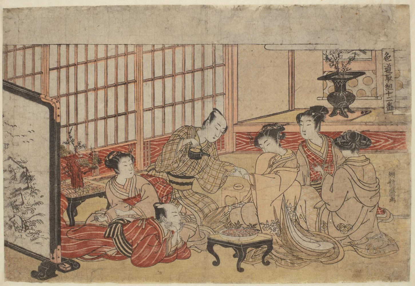 Japanese print of a group of people dressed in traditional clothes seated around a table in a luxurious room. One man is reclining and a woman sits behind him. Another man holds a woman's hand whilst pouring tea, two other women look on.