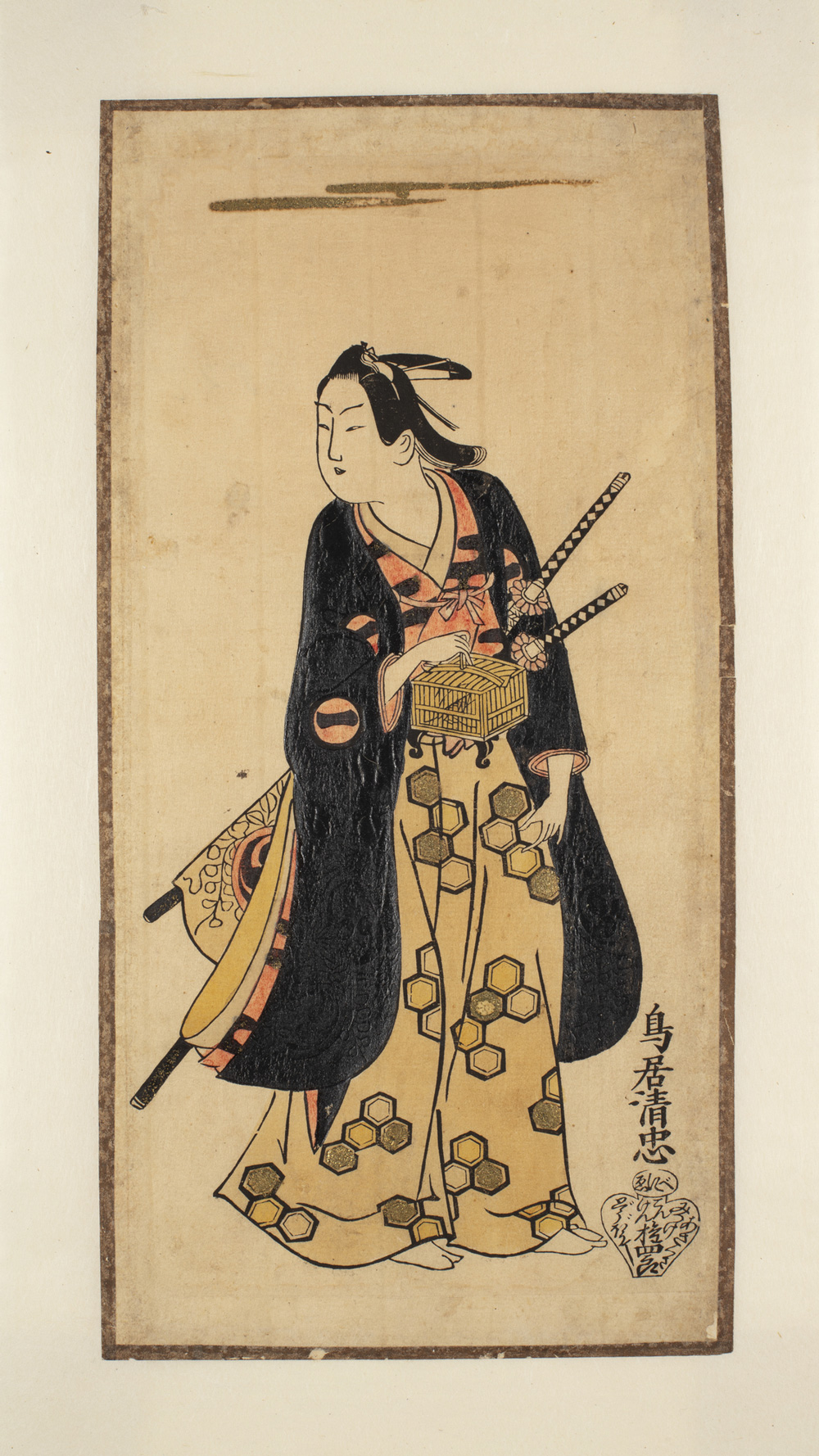 A Japanese print of an actor standing, wearing traditional robes. He has two staffs in his belt and holds a bamboo box.