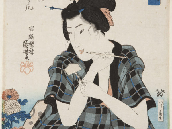 Japanese print of a person dressed in traditional clothes holding a pen and looking at a pot of flowers.