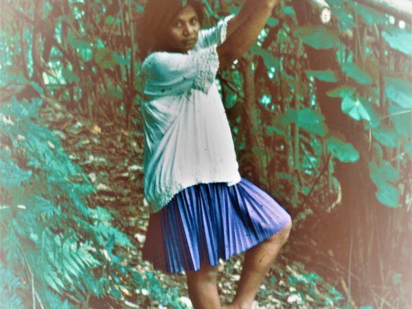 Colour photo of Rotee amongst trees, when she was living in Tarawa, Kiribati, 1974.
